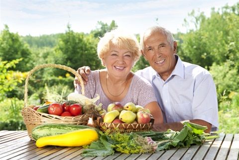 Elderly couple with fruit basket