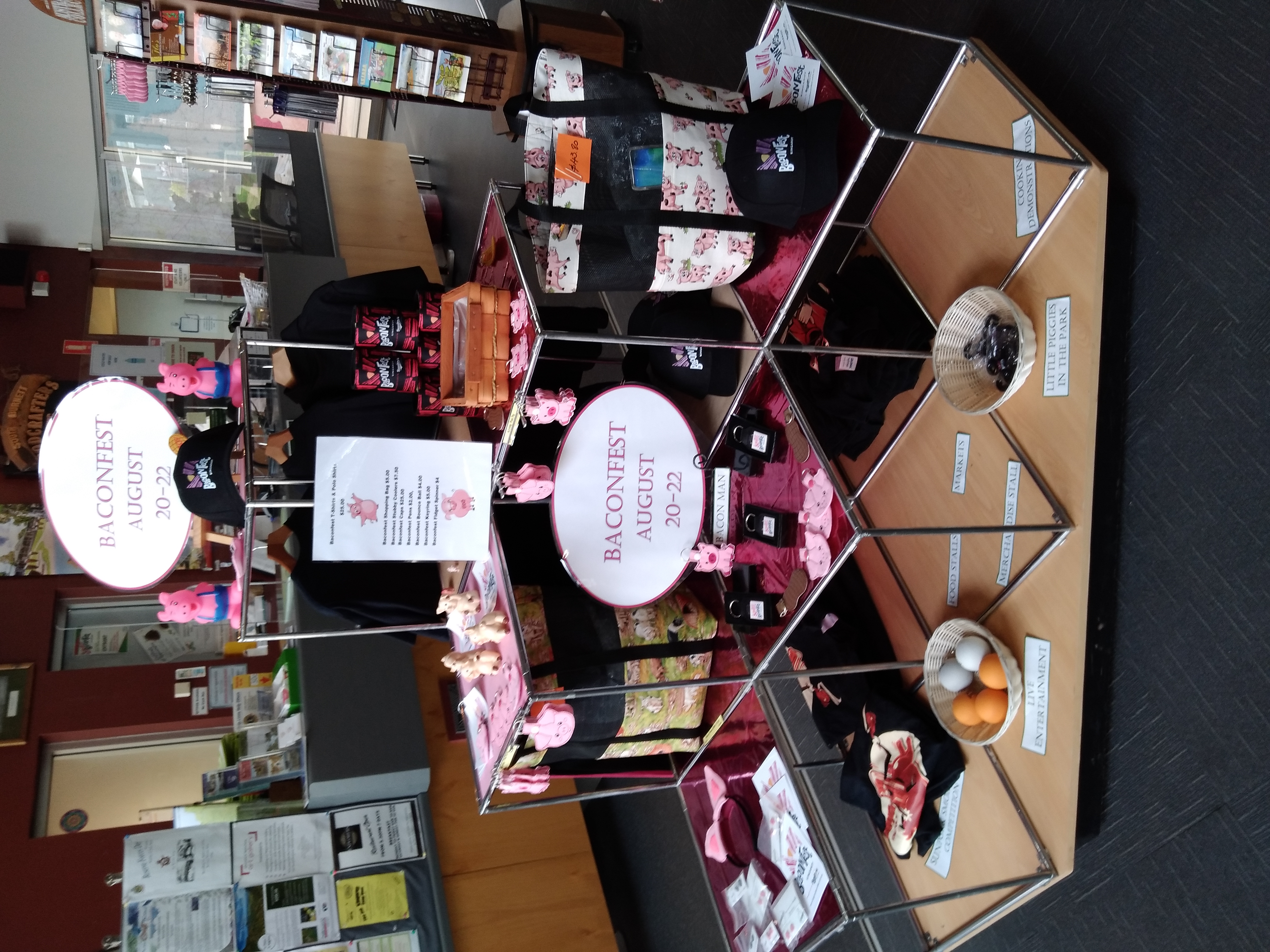 Image: BaconFest merchandise display stand at the Kingaroy Visitor Information Centre